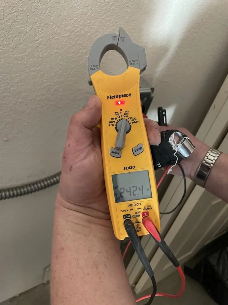 Voltage testing with clamp meter during Outlet Installation in Tarentum